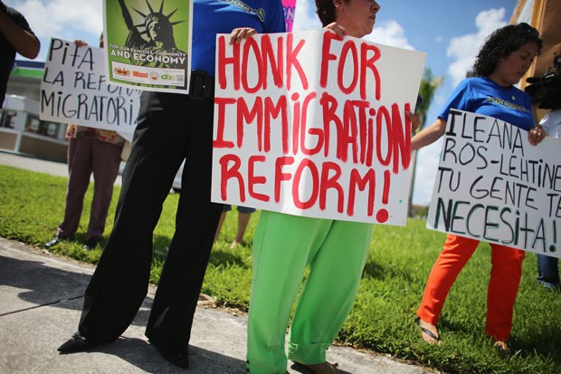 Protesters push for immigration reform at a rally on August 16, 2013 in Miami, Florida.