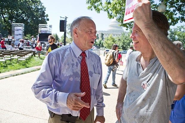 Rep. Steve King, R-Iowa, joins people opposed to current immigration legislation on Monday, July 15, 2013, in Washington. 