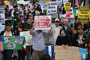 Demonstrators shout slogans during a rally in ...