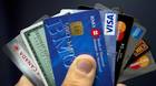 Credit cards are displayed in Montreal on December 12, 2012. The European Union has proposed a draft law to cap bank fees on credit card payments, plus surcharges on paying with plastic.