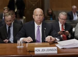 Homeland Security Secretary Jeh Johnson prepares to testify on Capitol Hill in Washington, Thursday, March 13, 2014, to outline President Barack
