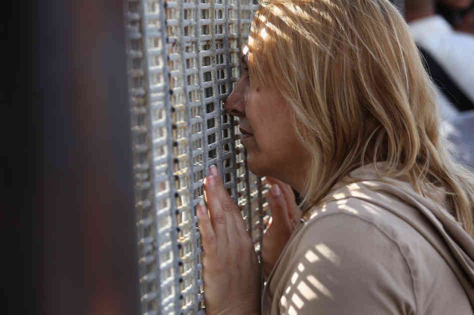 Families communicated through a border fence at San Diego's Friendship Park Nov. 17. On weekends, people on the American side are allowed to to visit, under U.S. Border Patrol supervision, with family and friends in Mexico.