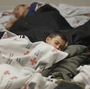 Child detainees in a holding cell at a Border Patrol facility in Brownsville, Texas. Some human smugglers who bring children across the Rio Grande make sure to treat their clients well.