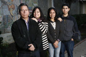 Ernesto Perez and his family are photographed in front of Our Lady of Guadalupe Church in San Jose, Calif., on Friday, Nov. 14, 2014. Standing left to