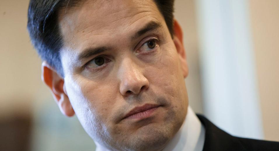 Sen. Marco Rubio, R-Fla., the son of Cuban immigrants, waits to make a statement at a news conference where he expressed his disappointment in President Barack Obama's initiative to normalize relations between the United States and Cuba, at the Capitol in Washington, Wednesday, Dec. 17, 2014.  (AP Photo/J. Scott Applewhite)