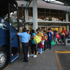Immigrants board a bus after being released from U.S. Border Patrol detention in Texas last month. An immigration judge says the Obama administration's "fast-tracking" effort means many people go into court without an attorney, opening a door to future problems.